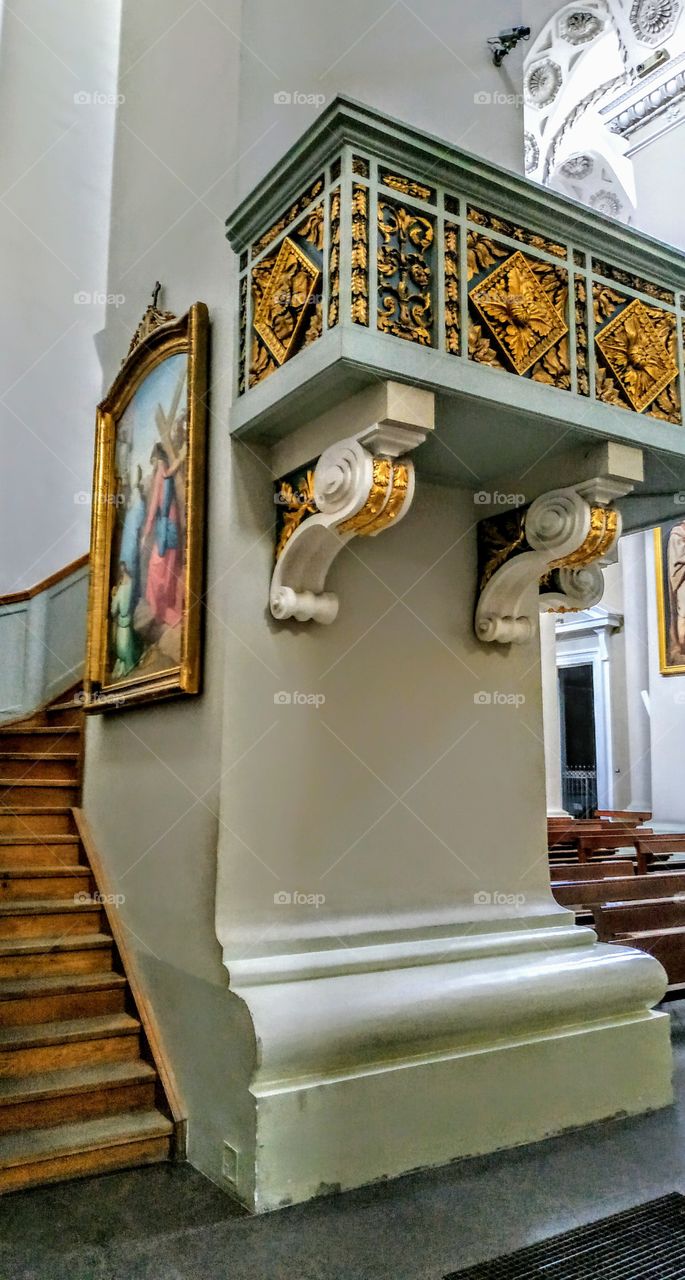 Near one of the columns of the work of old masters (Catholic Church, Vilnius, July, 2019).