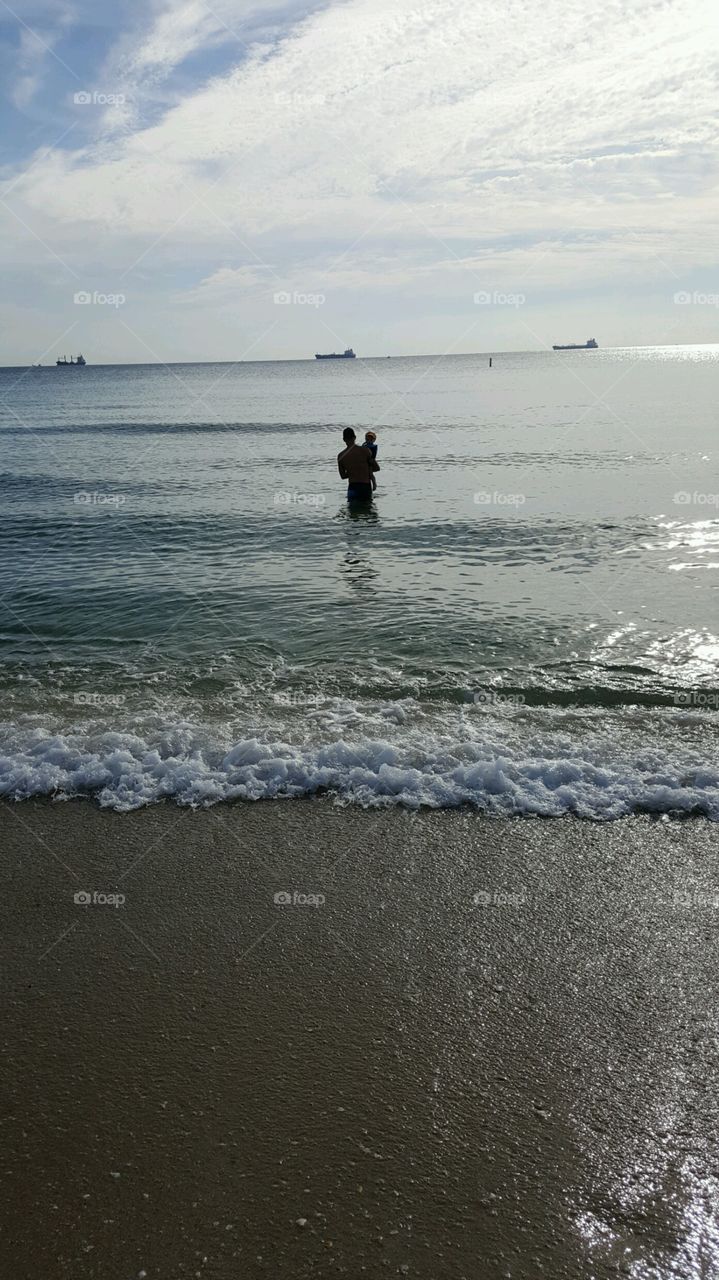 Daddy and son ocean swimming time in Ft. Lauderdale, FL!