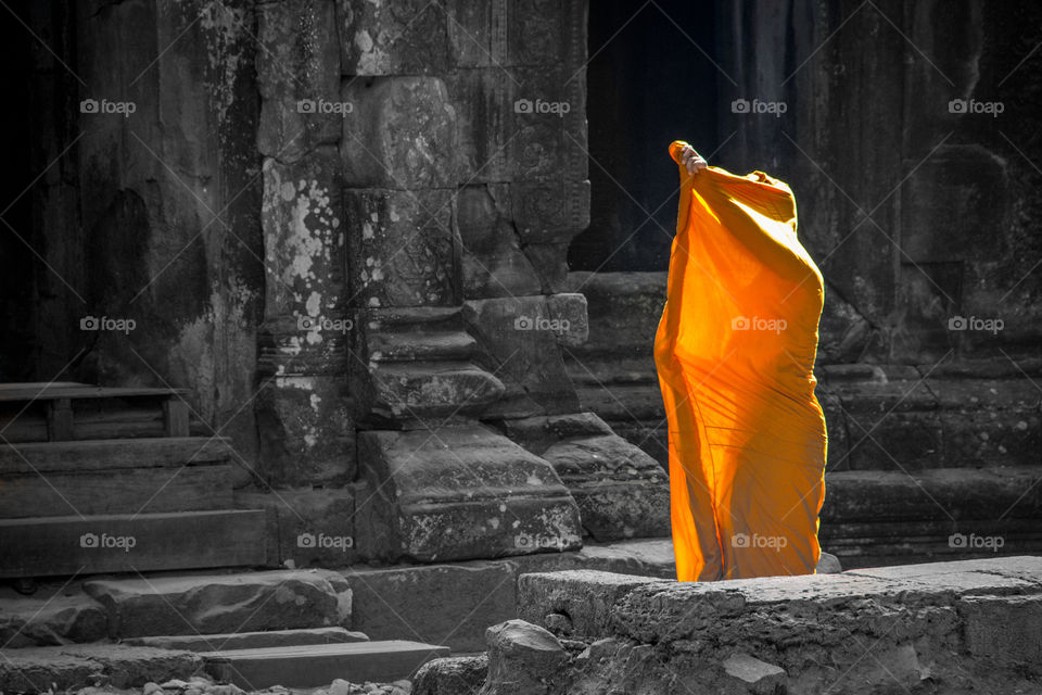 A monk in orange robe