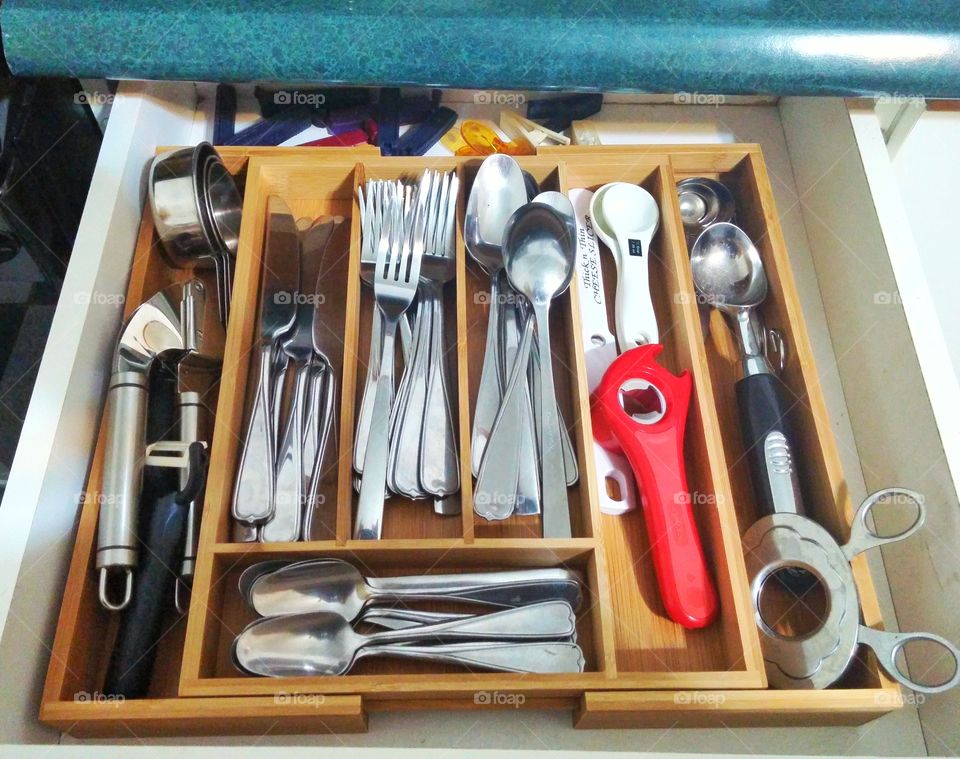 Stock photo of a full kitchen drawer