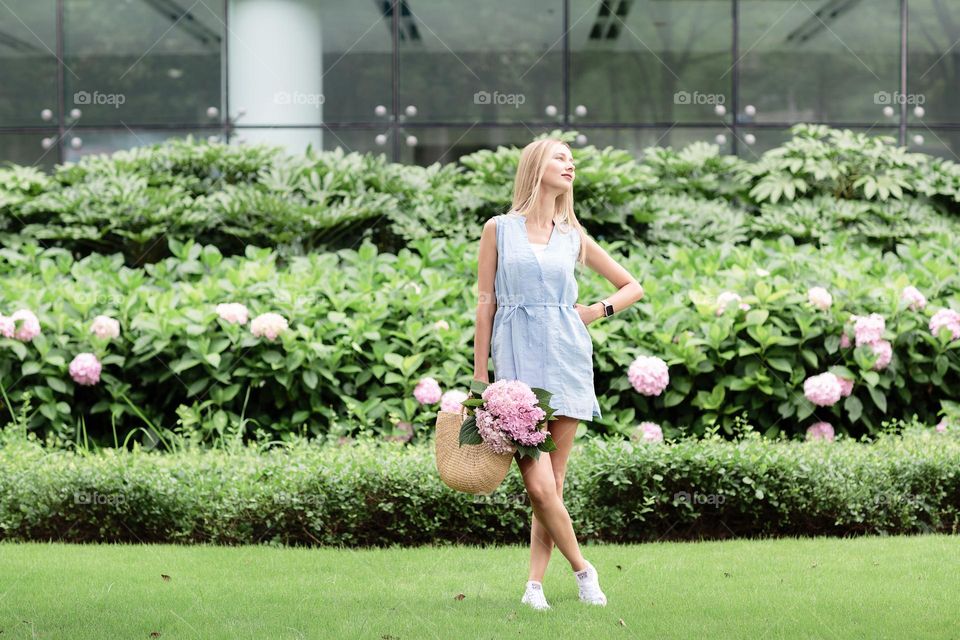 Lifestyle portrait of happy Caucasian woman with blonde hair wearing stylish fashionable clothing 