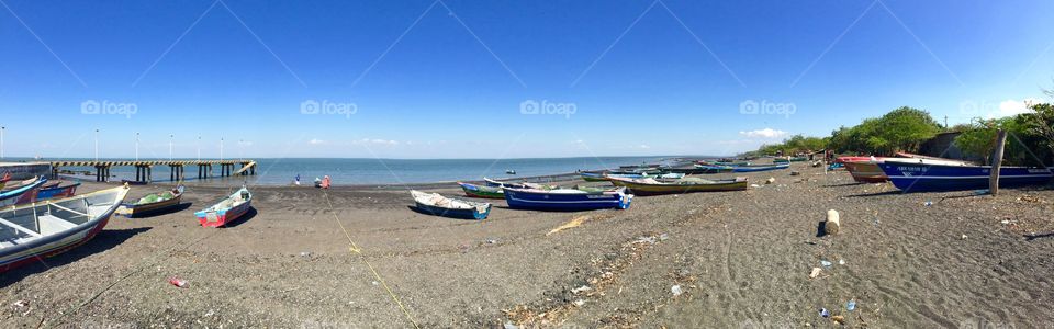 Shore. Dozens of boats line the shore in Puerto Sur, Nica