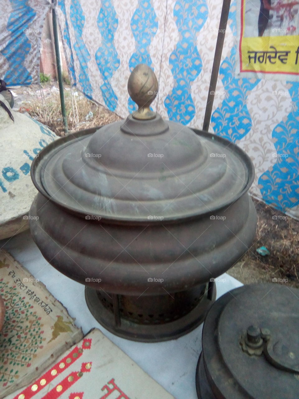 old and antique utensils made of brass.