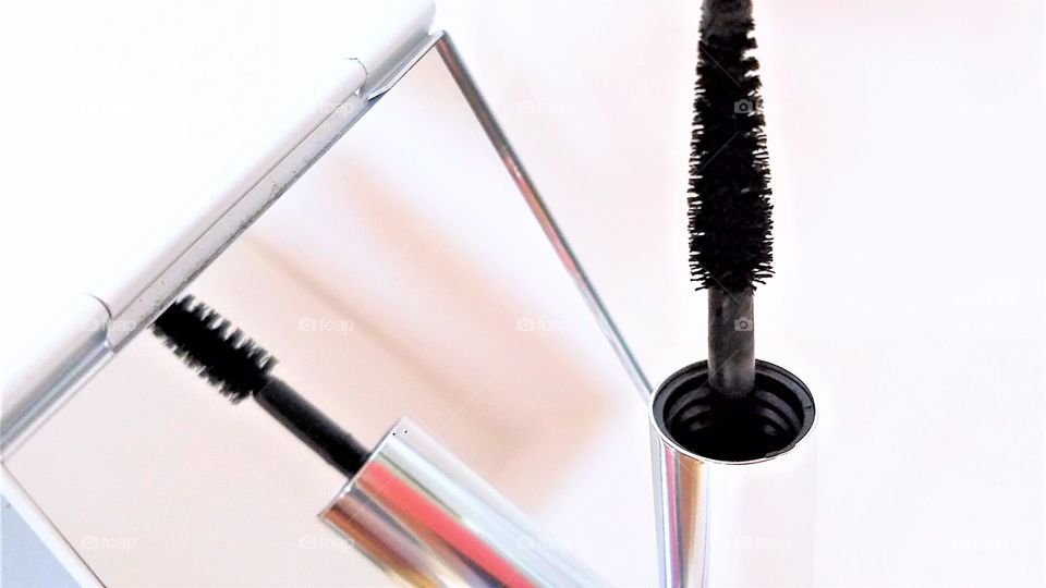 Mascara brush and hand mirror