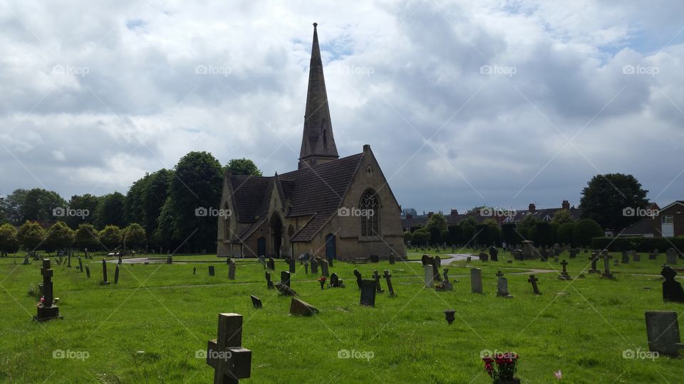 English cemetery and church
100 + years old graves
Some people think graveyard and cemetery mean the same, but, if we want to be a little nitpicky, we should say that graveyard is a type of cemetery, but a cemetery is usually not a graveyard. To understand the difference, we need a little bit of history.
From about the 7th century, the process of burial was firmly in the hands of the Church (meaning the organization), and burying the dead was only allowed on the lands near a church (now referring to the building), the so-called churchyard. The part of the churchyard used for burial is called graveyard, an example of which you can see in the picture.
As the population of Europe started to grow, the capacity of graveyards was no longer sufficient (the population of modern Europe is almost 40 times higher than it was in the 7th century). By the end of the 18th century, the unsustainability of church burials became apparent, and completely new places, independent of graveyards, were devised—and these were called cemeteries.
The etymology of the two words is also quite intriguing. The origin of "graveyard" is rather obvious; it is a yard filled with graves. However, you might be surprised to hear that "grave" comes from Proto-Germanic *graban, meaning "to dig", and is unrelated to "gravel".
Of course, the word "cemetery" did not appear out of the blue when graveyards started to burst at the seams. It comes from Old French cimetiere, which meant, well, graveyard. Nevertheless, the French word originally comes from Greek koimeterion, meaning "a sleeping place". Isn't that poetic?