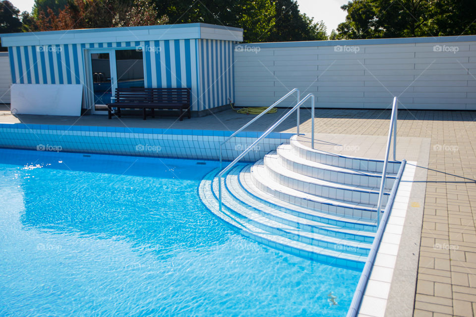 Stairs and a pool house of a swimming pool