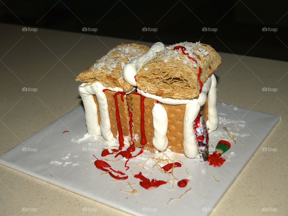 Gingerbread house made out of grahamcrackers  and shredded wheat 