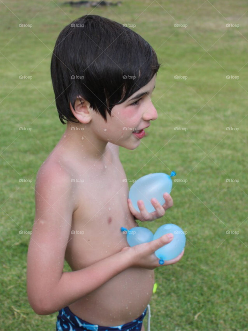 Brazilian babies playing outside the pool