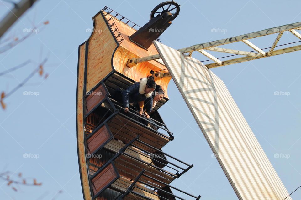 two girlfriends fly on a scary ride in the park