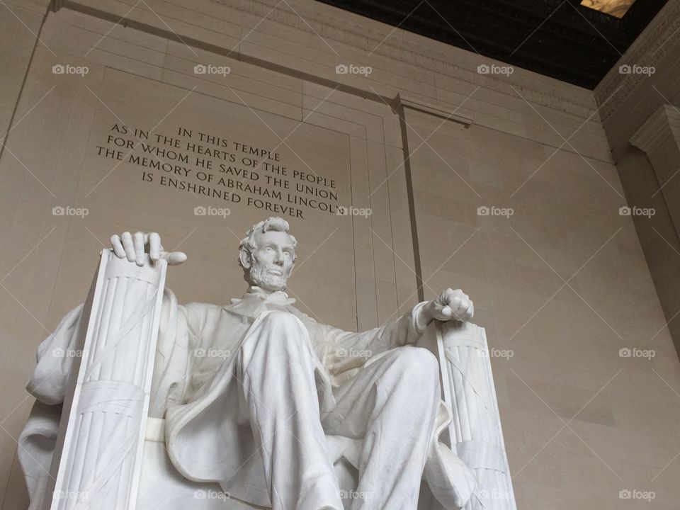 The iconic statue of Abe Lincoln inside the Lincoln memorial. 