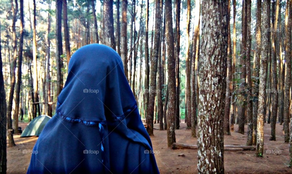 women in the pine forest