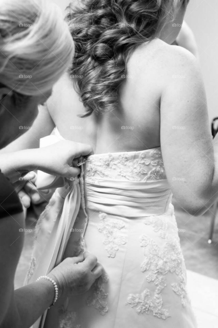 Lady adding finishing touches to dress