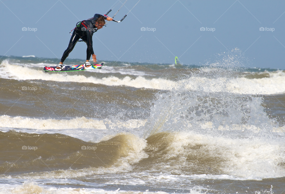 Kite surfer jumping high