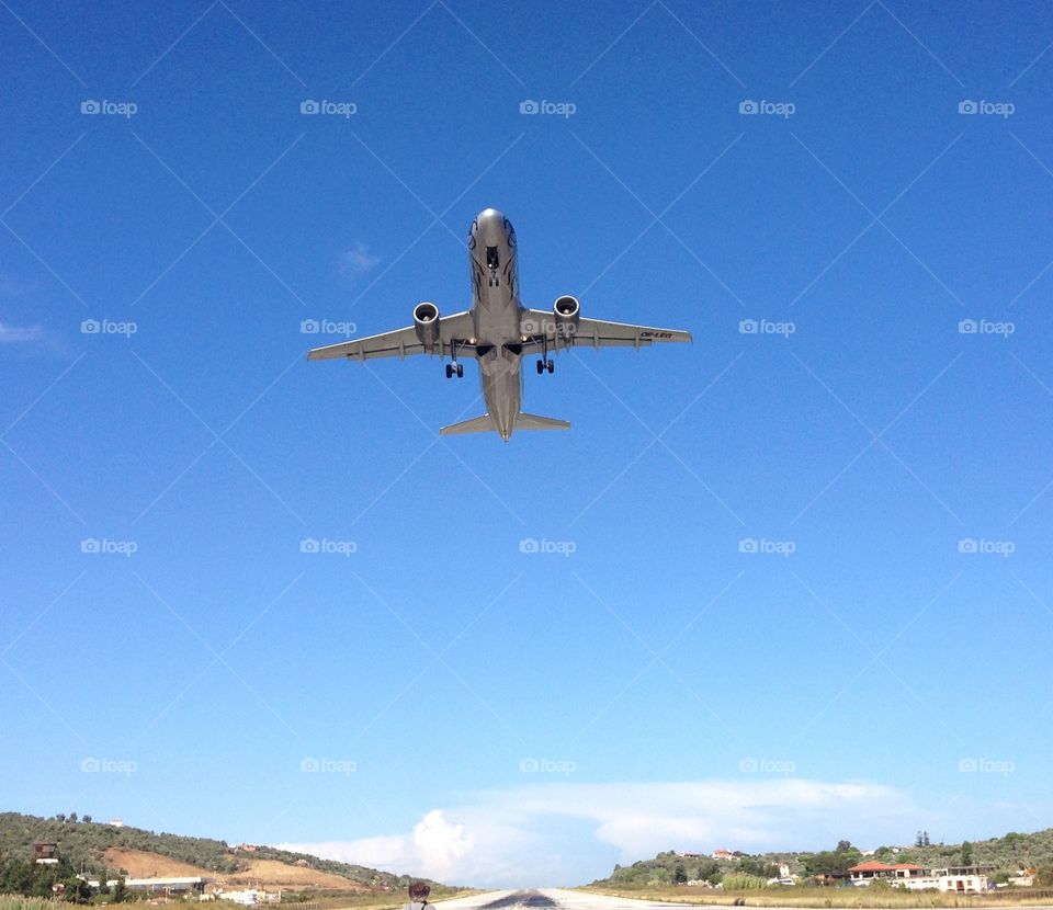 Flight taking off. Standing at the end of the runway watching the planes taking off