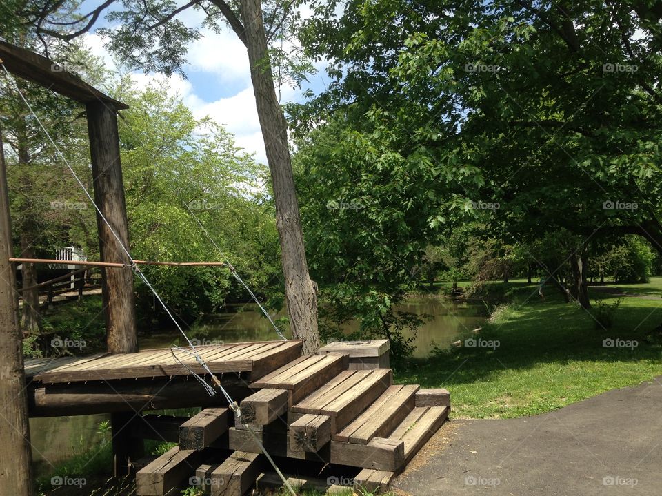 Wooden steps to bridge. Steps leading to a wooden bridge