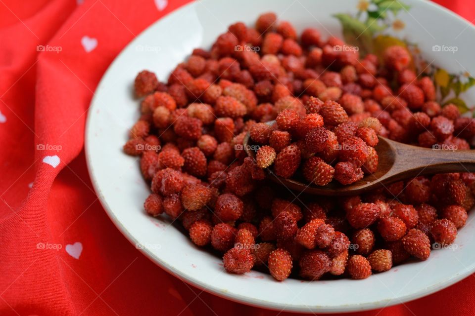 red strawberries on a plate tasty healthy summer food red background