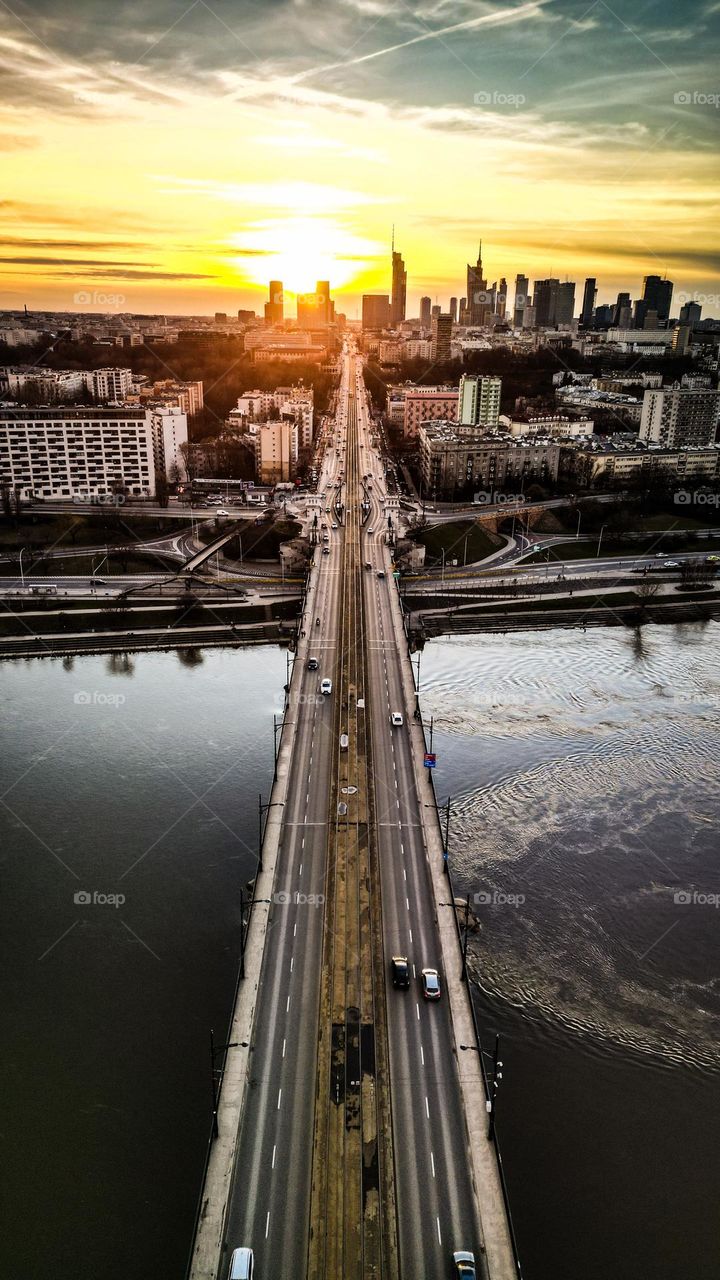 Aerial view of Poniatowski bridge in Warsaw during golden hour. River Wisła.