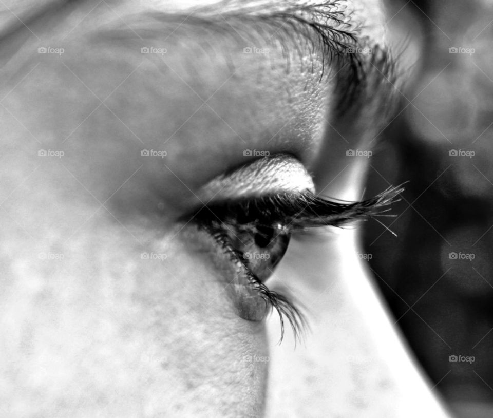One eye Witz long eyelashes in Black and white.