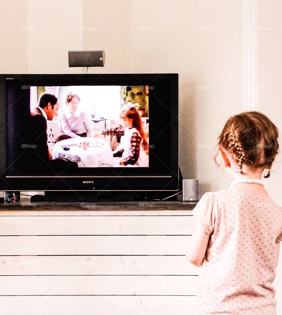 Little girl watching tv