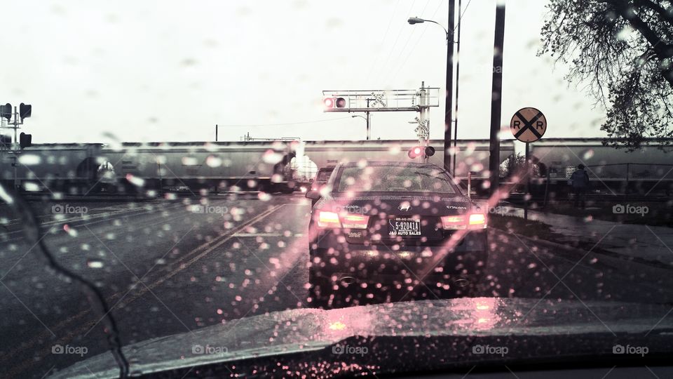 stuck at the railroad crossing in the rain