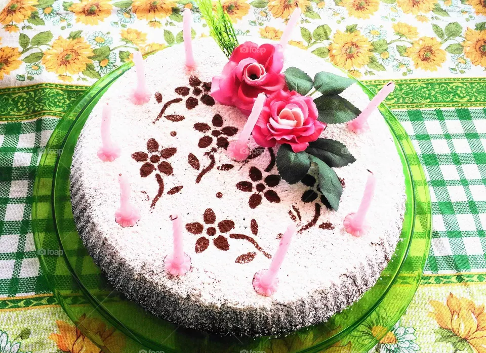 Homemade Birthday cake decorated with candles and roses