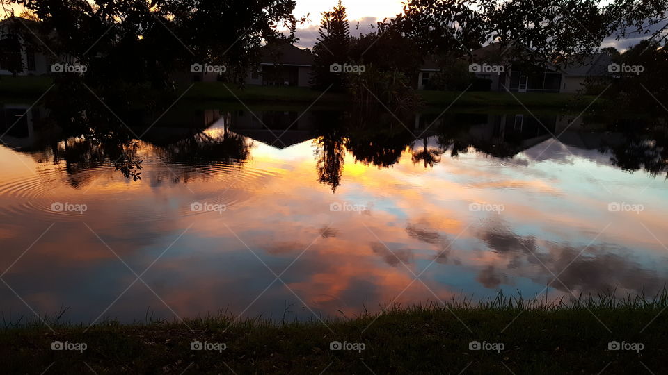 Reflection of cloudy sky in lake