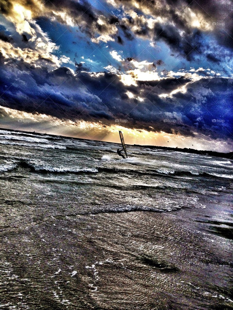 Windsurfer in stormy weather