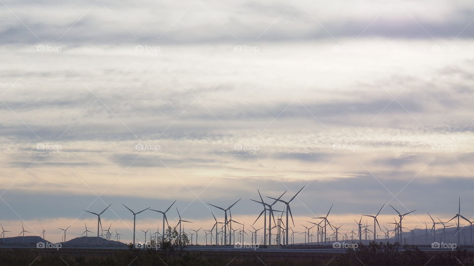 Eolic power farm landscape. California eolic wind power plant farm sunset desert