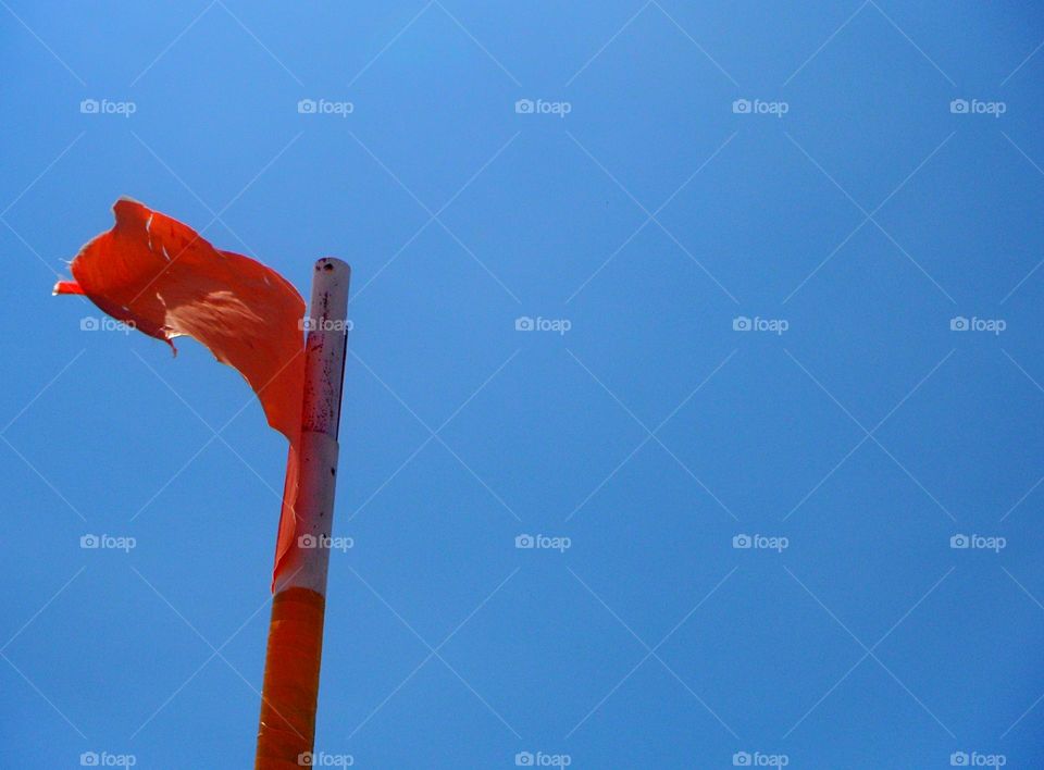 orange color story: orange flag in the sky