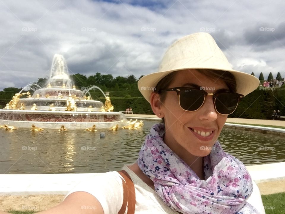 Selfie in front of fountain. Selfie in front of the Latona fountain in the garden of Versailles. 