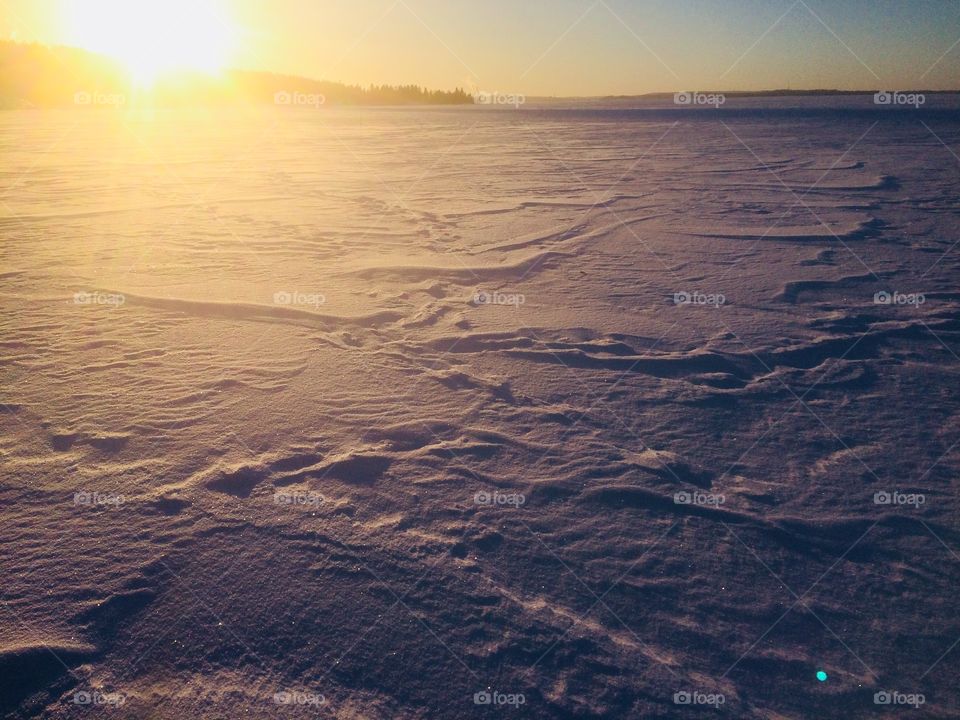 The snowy surface of Frozen Ice in Sunset 