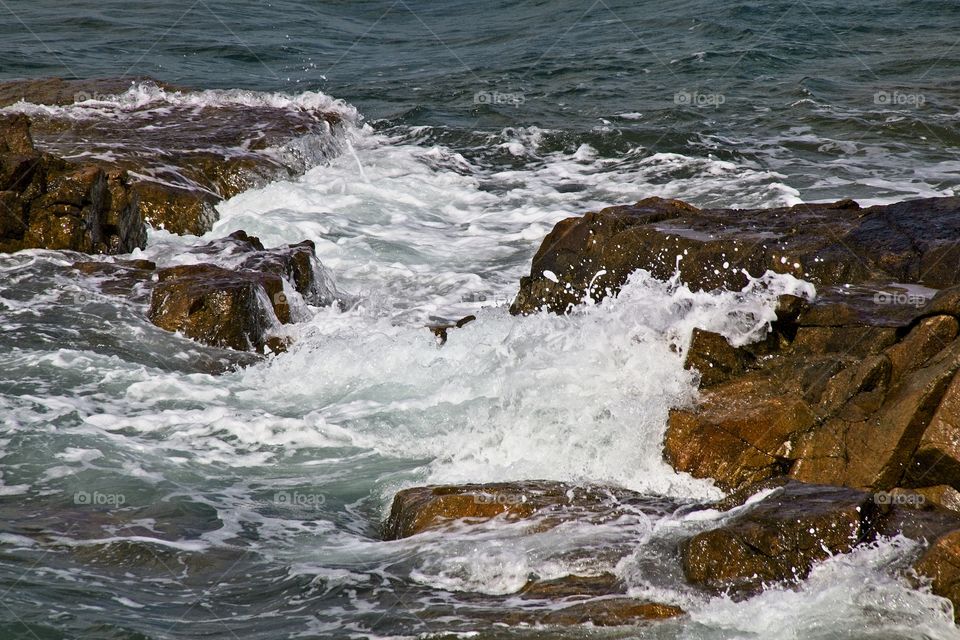 waves crashing on rocks