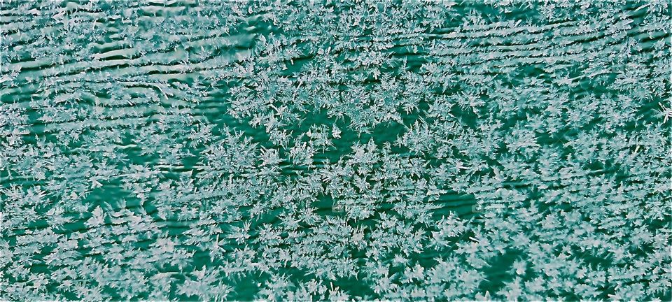 Interesting shapes evolve every morning during the winter season when ice crystals form, cluster together and then spread out across a surface according to its elemental properties. 2023. Hypnotic Productions