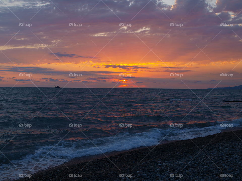 Surf at beach during sunset