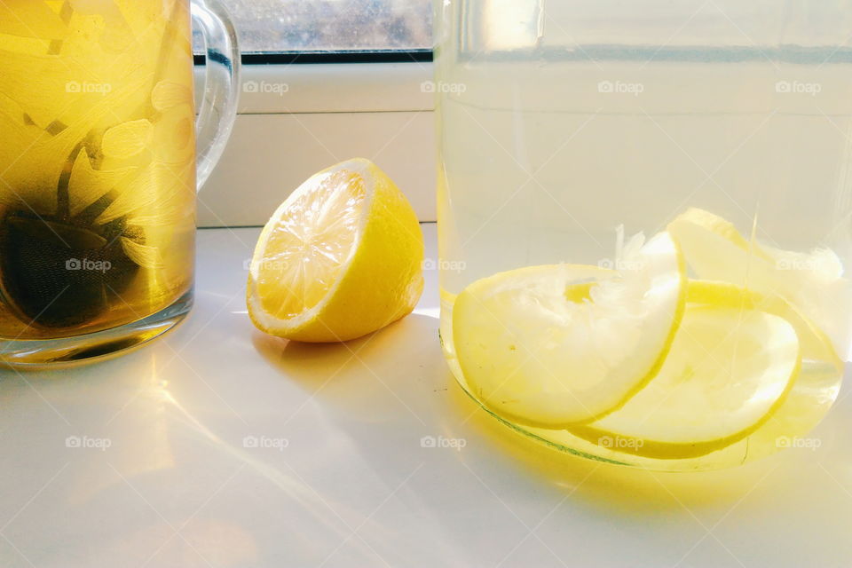 home lemonade with lemon and a cup of tea