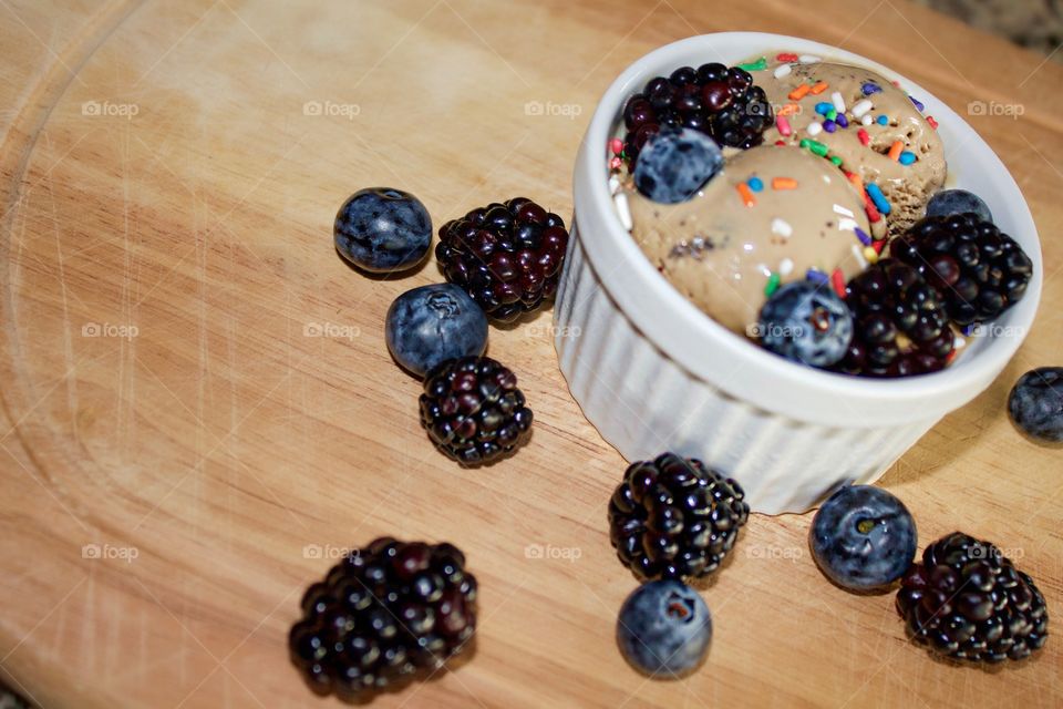 Blackberries and blueberries with ice cream