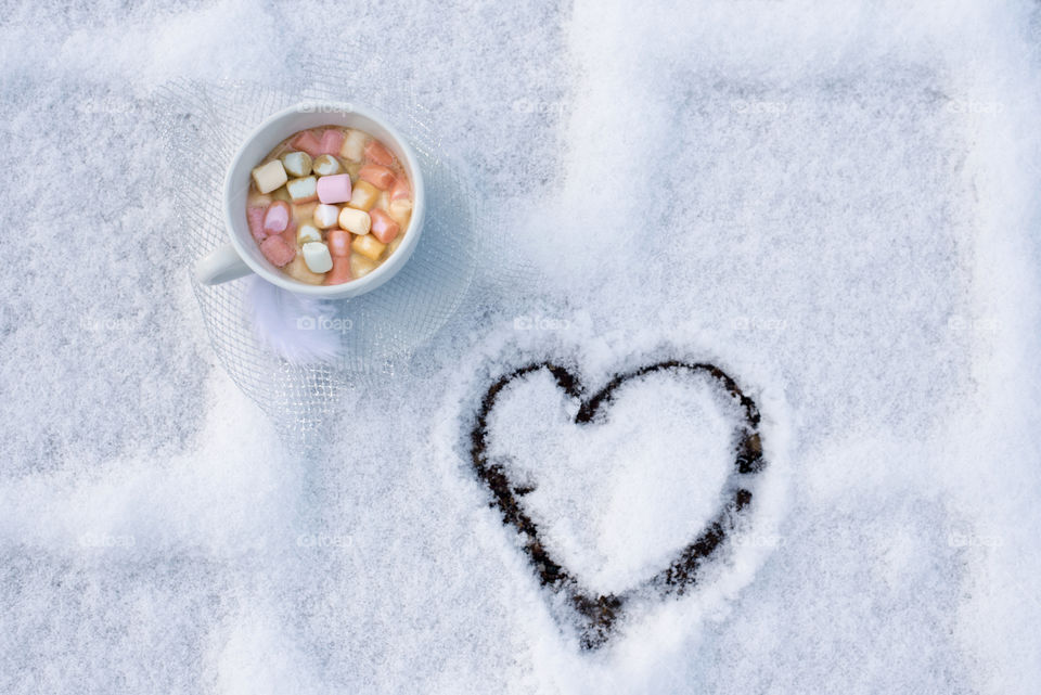 coffee with marshmallow on snow