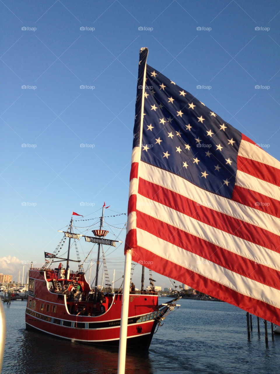 American flag and pirate ship