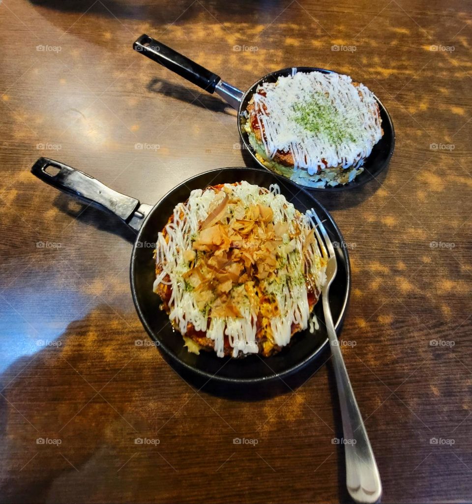 Okonomiyaki with mayonnaise, bonito flakes ,and seaweed powder