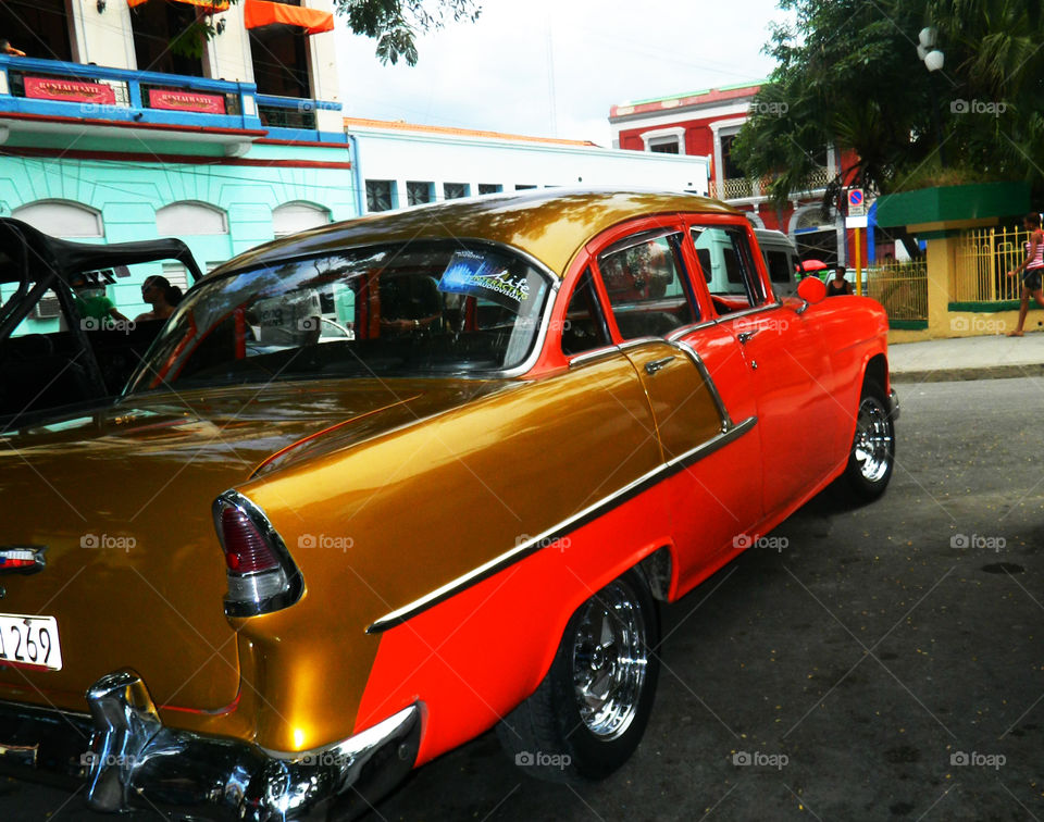 Side view 1955 Chevy in Cuba. This is a photo of the side view of an antique 1955 Chevy in downtown Santiago, Cuba last week. It was an eye catcher!