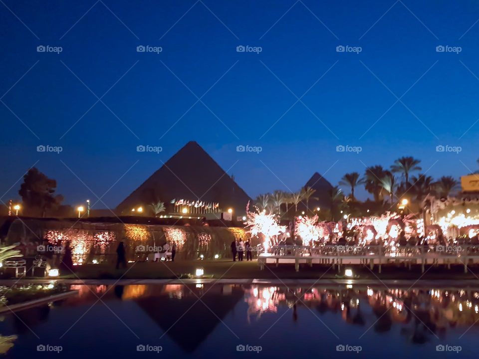 Great pyramids of Giza at night, seen from the Mena House Cair