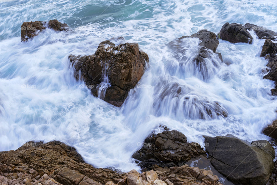 wave splash on solid rocks