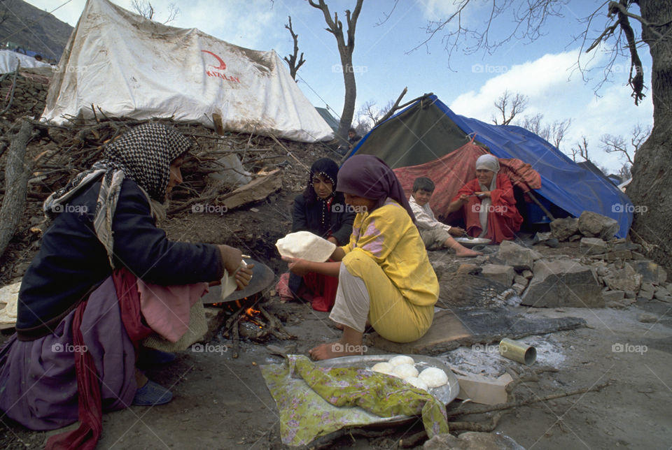 Kurdish refugees at a muddy camp on the Iraqi border, during another crisis in their lives. The Kurds are an ethnic group in Western Asia, mostly inhabiting a region known as Kurdistan, which includes adjacent parts of Iran, Iraq, Syria, and Turkey.