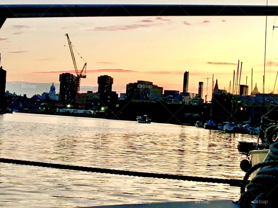 A sunset picture taken from aboard our sailboat, the „Salvation“ at Newtown Creek in Long Island City, Queens, NY during the early evening hours in December 2021. Hypnotic Productions