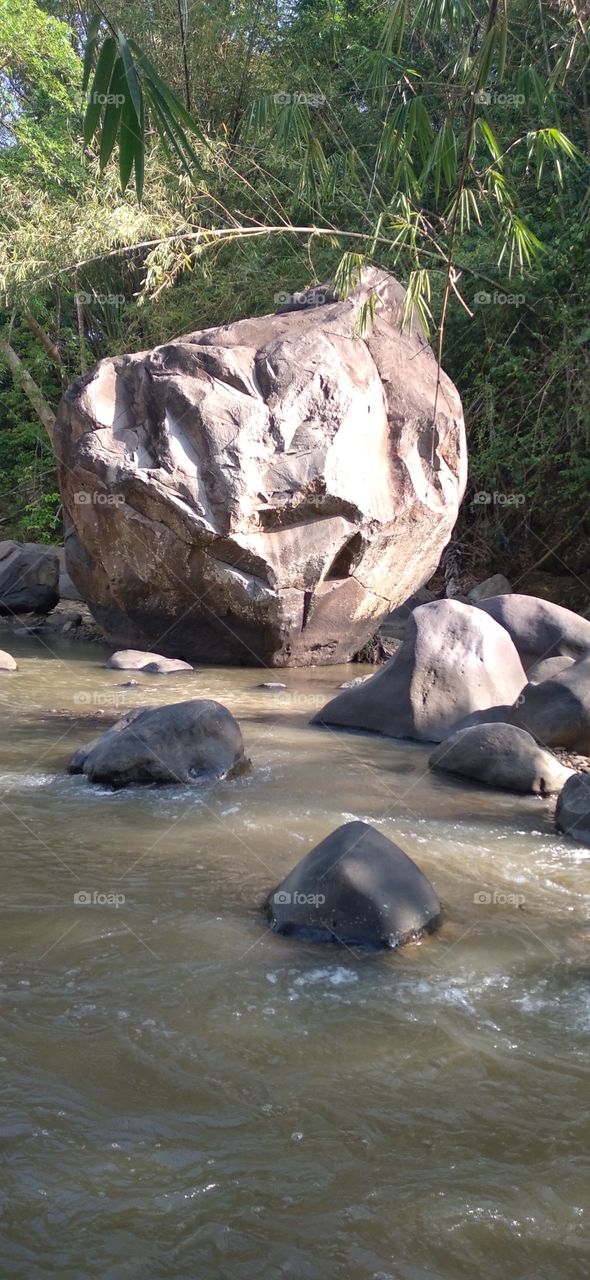 The big rock in the middle of the river