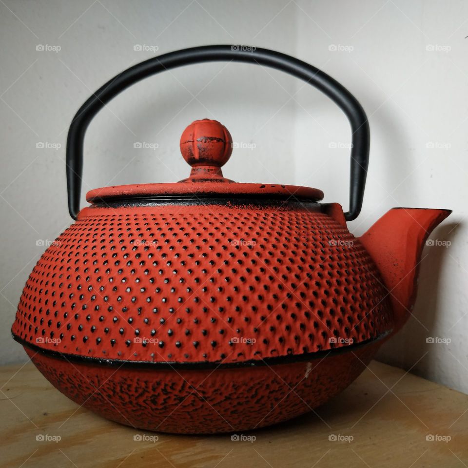 Japanese red cast iron teapot. The tea ceremony in Japan was an event reserved only for the noble caste. It was a time to unite the spirit with the body.