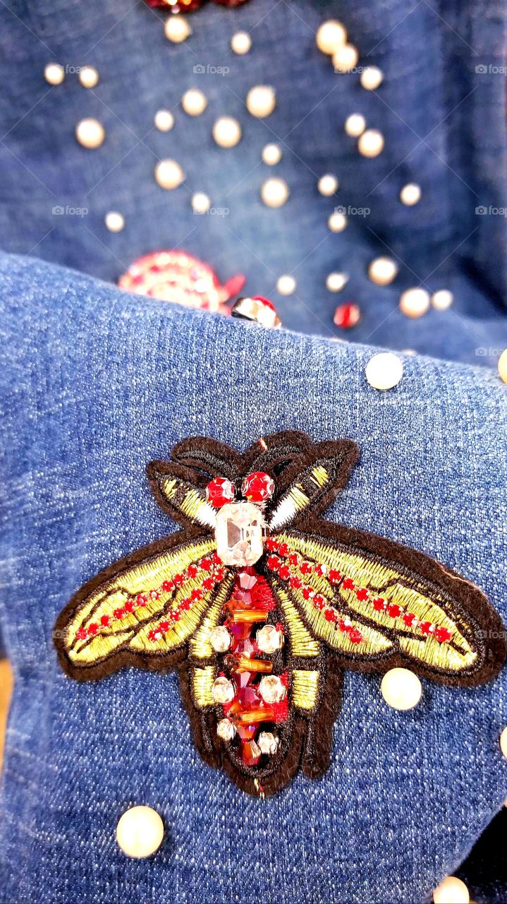 Hand made Beatle applique of beads on jeans