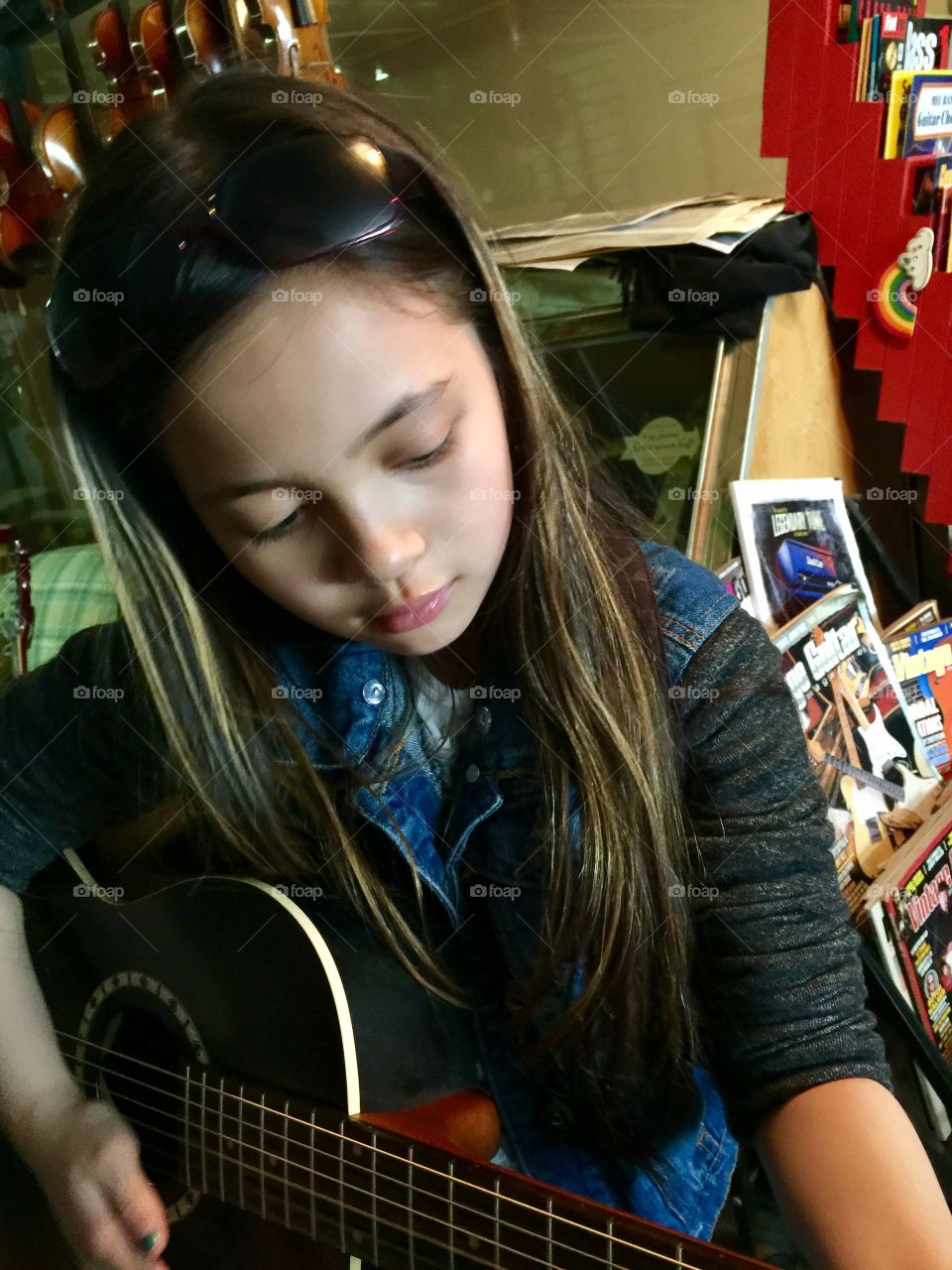 My 10 year old daughter shopping for a new guitar 
