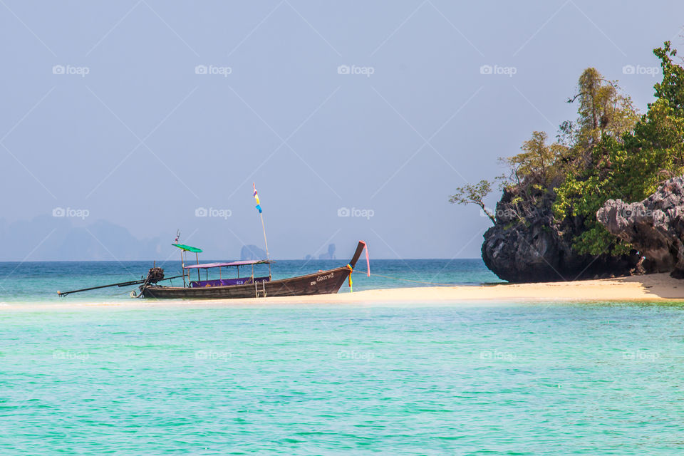 Boat moored at beach