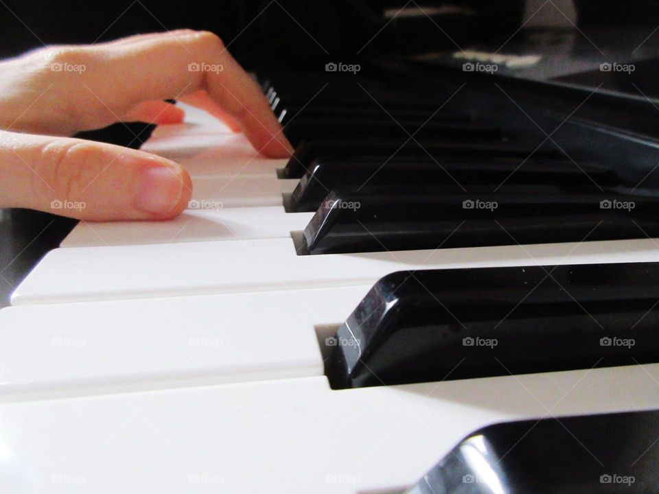 close-up piano playing